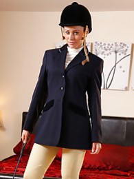 Teens4Free presents: Clare R seductifvely removes her riding gear leaving on only opaque hold ups and sheer underwear